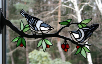 Stained glass birds on a branch window art